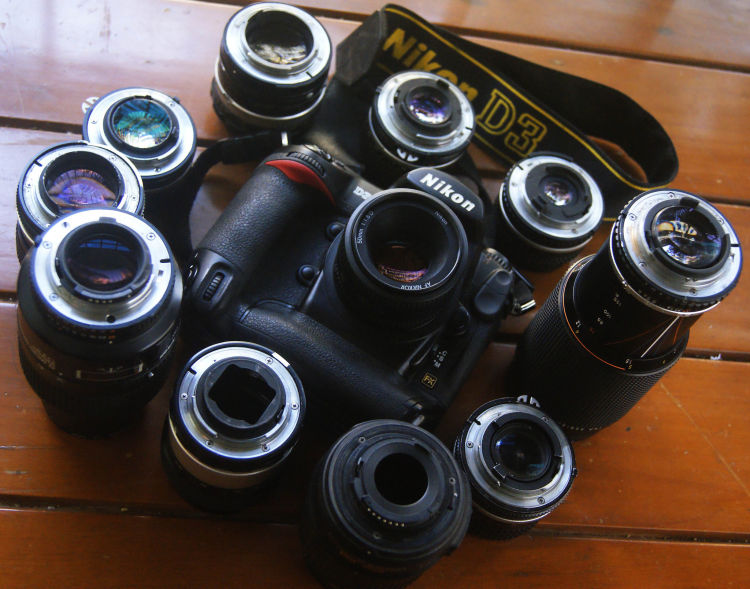 A Nikon DSLR with numerous lenses. (Source image: Bharat Mirchandani / Flickr (CC BY-SA 2.0))